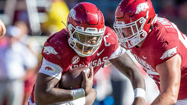 Arkansas Razorbacks quarterback KJ Jefferson tucks the ball and takes off running in Saturday's 49-26 loss to the Alabama Crimson Tide at Razorback Stadium.